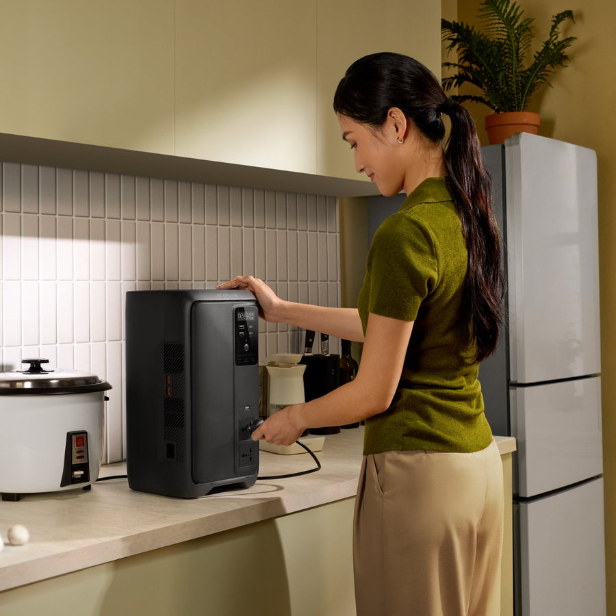 EcoFlow DELTA 3 2000 Air power station running indoors beside a refrigerator during a brownout